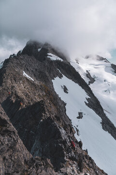 Mountaineers Navigating Snowy Ridge in Tantalus Range