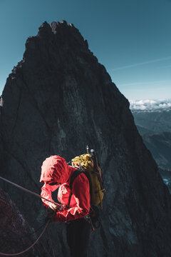 Climber Adjusting Gear on Mountain Ridge in Tantalus Range