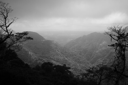 Misty black and white mountain valley view