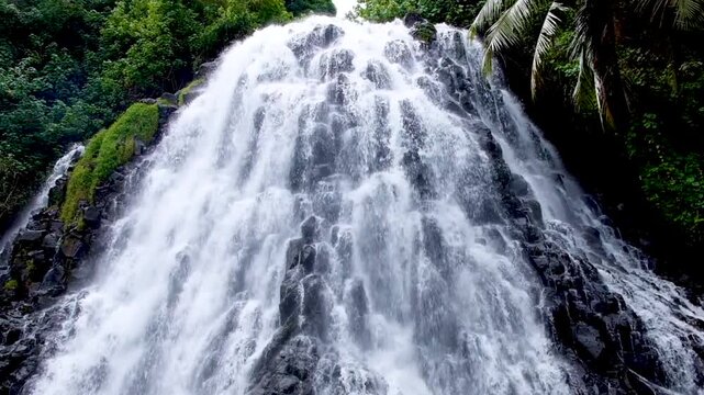 Scenic view Kepirohi waterfall cascading over rocks in Pohnpei Federated States of Micronesia