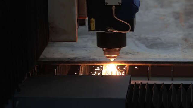 Industrial laser cutting machine processing metal sheet