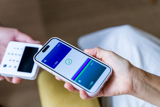 Mobile phone making contactless payment with digital wallet