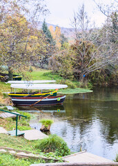 Fototapeta premium Wooden boats on the Black Drin Springs near Saint Naum