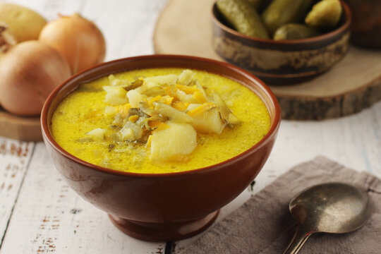 A bowl with traditional soup in Poland Zupa Ogorkowa	