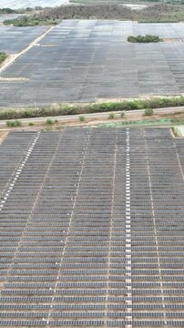 Large Scale Photovoltaic Power Plant Representing Renewable Energy Transition and Sustainable Electricity Generation. Establishing Shot. Aerial View. Vertical Video.