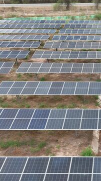 Colombia's Largest Solar Park with 360 MWp Photovoltaic Energy Infrastructure near the Magdalena River. Establishing Shot. Aerial View. Vertical Video.