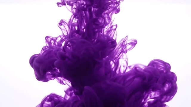 Purple ink cloud swirling and dissolving slowly in clear water, abstract fluid motion, dynamic smoke effect, background for design.