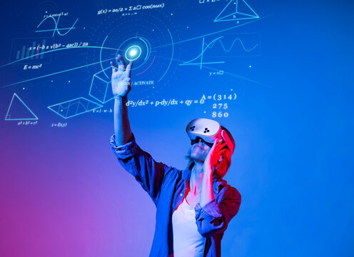 Mature woman using virtual reality headset to study mathematics