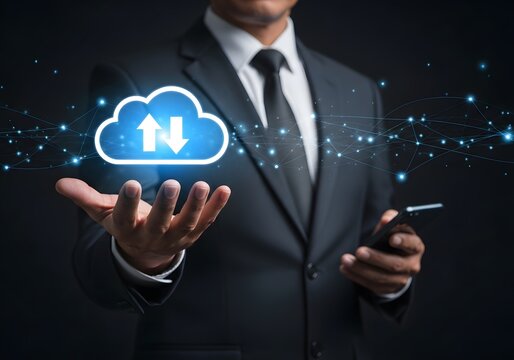 Businessman in suit holding smartphone with glowing cloud storage and data synchronization icon