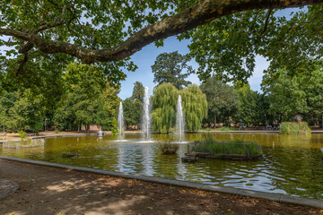 Fototapeta premium Bethmannweiher, a pond in the rampart gardens of Frankfurts city center, Germany