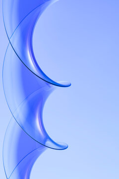 Curved blue glass fins forming a minimal digital gateway on copy space 3D