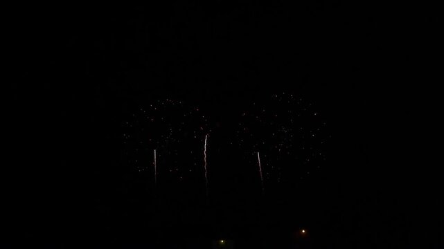Fireworks lighting up the night sky at a summer fireworks festival