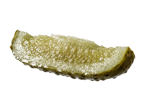 Macro photography of a single pickle spear isolated on black background featuring wet texture and seeds, capturing a crisp culinary detail for food menu design and deli snack marketing.