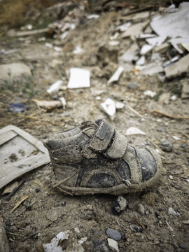 Baby shoe in the trash