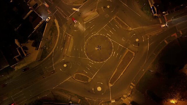 Illuminated Magic Roundabout Traffic Junction at Night Aerial Hyperlapse