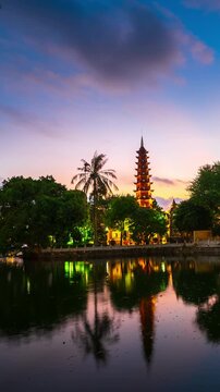 Vertical video, Tran Quoc pagoda and sunset sky, oldest temple, Hanoi,Vietnam.