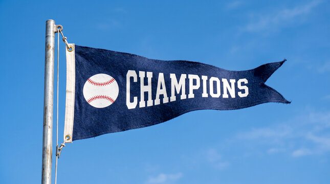 Championship flag with baseball symbol waving in the blue sky  