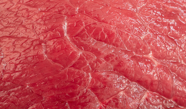 Raw beef steak macro pattern, red meat slice closeup