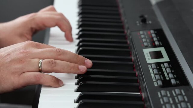 Musician Playing Piano, Close Up of Hands on Keyboard. Close-up of musician hands playing piano, practicing and performing music on a keyboard. Music education, piano lessons, musical hobby concept.