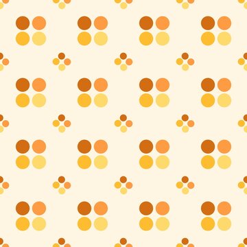 Abstract seamless polka dot pattern in warm orange tones