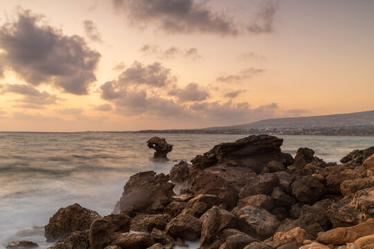 Rocky Mediterranean coastline at sunset near Paphos, Cyprus