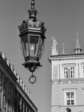Vintage lantern hanging in front of Juliusz Slowacki Theatre in Krakow black and white