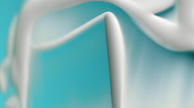 White cosmetic cream smearing on a turquoise background, macro shot of beauty product texture