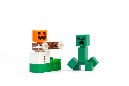 Minecraft Creeper standing beside a Snow Golem character with pumpkin head on a white background on Sep 21, 2026 in Jakarta, Indonesia