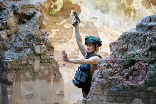 Armed Woman in Tactical Gear Training Among Abandoned Ruins