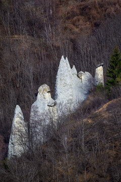 The Pyramids of Euseigne, natural earth pyramids topped with glacial boulders in Valais, Switzerland
