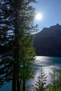 Sun&rsquo;s reflections on Tseuzier lake in Valais, Switzerland