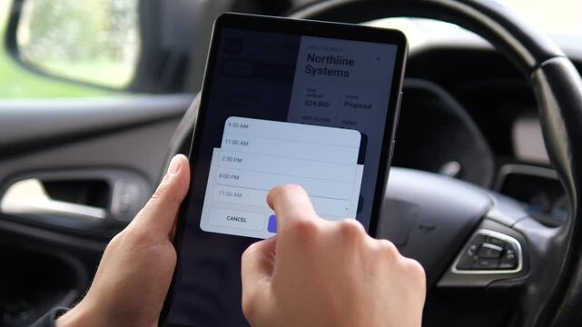Business professional uses a tablet CRM inside a car to review a sales opportunity, open deal details and schedule a follow-up call with a potential client.