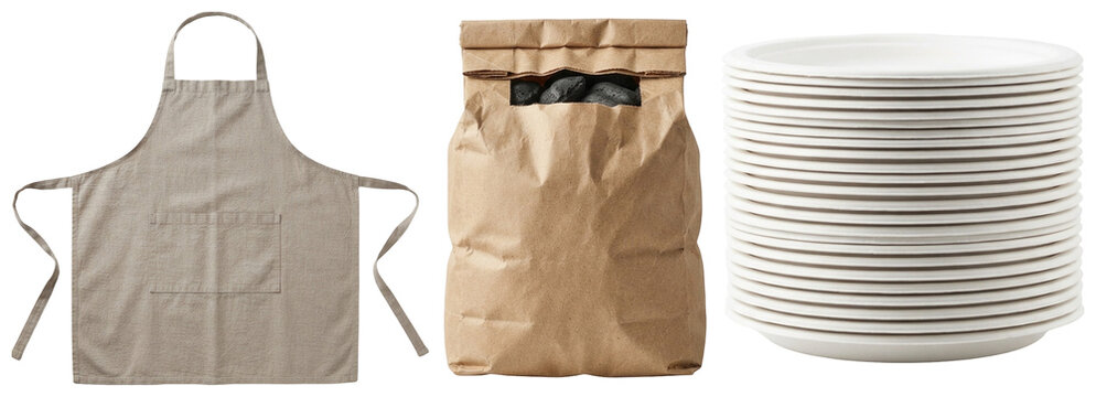 A collection of essential backyard barbecue items including an apron, disposable paper plates, and a bag of charcoal briquettes.