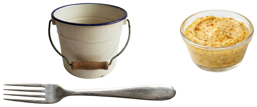 A collection of clam boil essentials including a serving pail, garlic butter dip, and seafood fork for a coastal seafood feast.