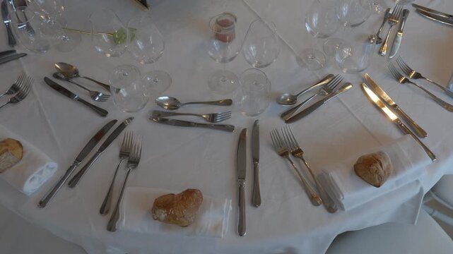 High Angle View of Formal Wedding Banquet Table Setting with Crystal Glasses and Cutlery