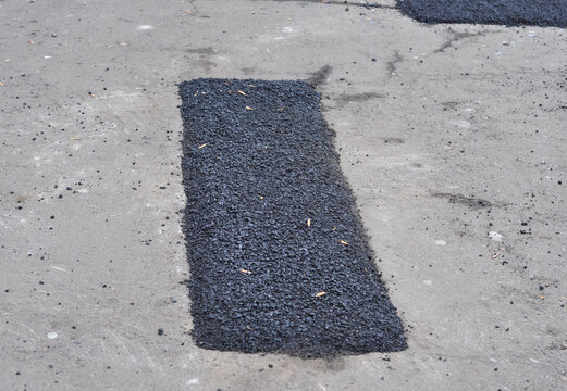 Pothole Patching Repair on Asphalt Road