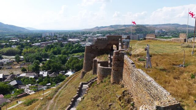 The Walled Gori Fortress Citadel Stands On A Rocky Hill Above Gori In Georgia. Aerial Rotating Shot