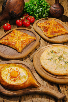 Georgian khachapuri dishes on rustic wooden table