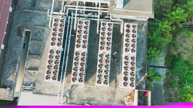 Aerial view of industrial HVAC units arranged in rows on a concrete rooftop in Malang, East Java, Indonesia.
