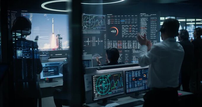 Monitoring Control Room: Aerospace Flight Specialists Watch a Rocket Lift Off From the Launchpad on Big Screens, Verify Ascent Telemetry Data, Then Applaud as the Spacecraft Reaches Stable Orbit.