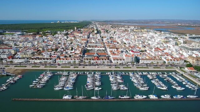 Stunning aerial perspective capturing the marina and the charming town of vila real de santo antonio, showcasing the beautiful coastline and urban landscape of the algarve region in portugal