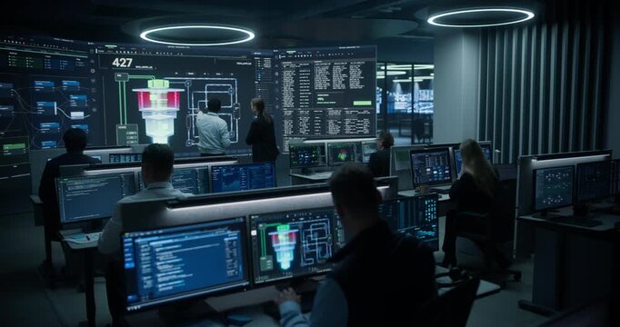Nuclear Energy Powerplant Monitoring Control Room. Engineers Track Stable Reactor Performance on Digital Dashboards, Using Advanced Science and Quantum Computer Technology 