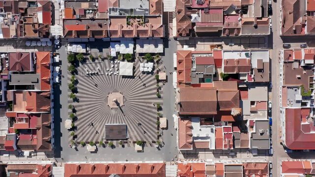 Aerial top down view of the historical town of vila real de santo antonio with a geometrical pavement plaza in the algarve region of portugal, a famous landmark for tourists