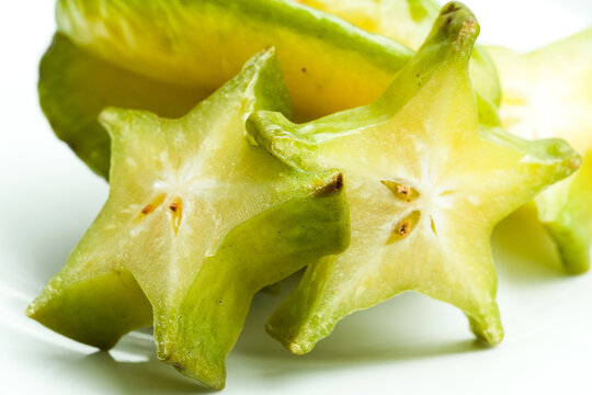 Fresh star fruit pieces showing distinctive geometric shape