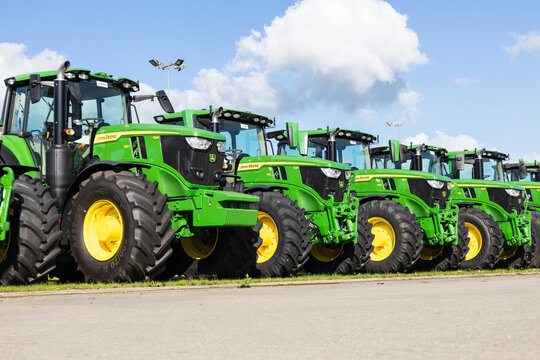 Green agricultural tractors parked in a row outdoors. Kaunas, Lithuania, 28 September 2026