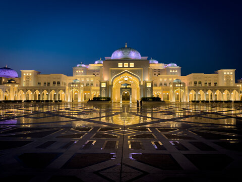 Abu Dhabi, Abu Dhabi, United Arab Emirates - 14 September 2024: View of Qasr Al Watan illuminated at night with intricate courtyard patterns and glowing arches under a deep blue sky.