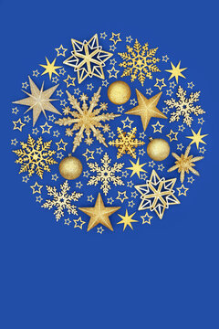 Gold star snowflake bauble tree decorations in circular design on blue background. Luxury abstract festive arrangement for greeting card, gift tag logo.