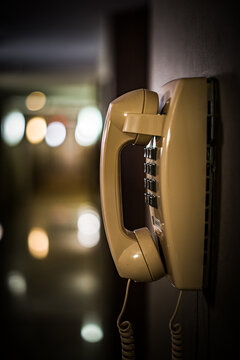 Old land line phone on a hallway wall