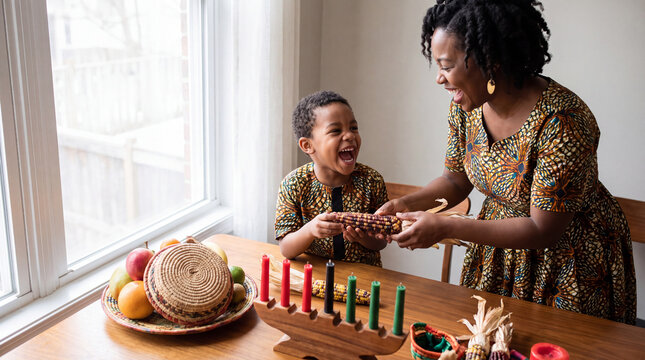 Bright winter morning joy as a mother passes decorative corn to her laughing little boy for Kwanzaa.