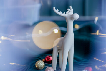 Elegant white reindeer figurine with festive ornaments and soft lights © Rawpixel.com